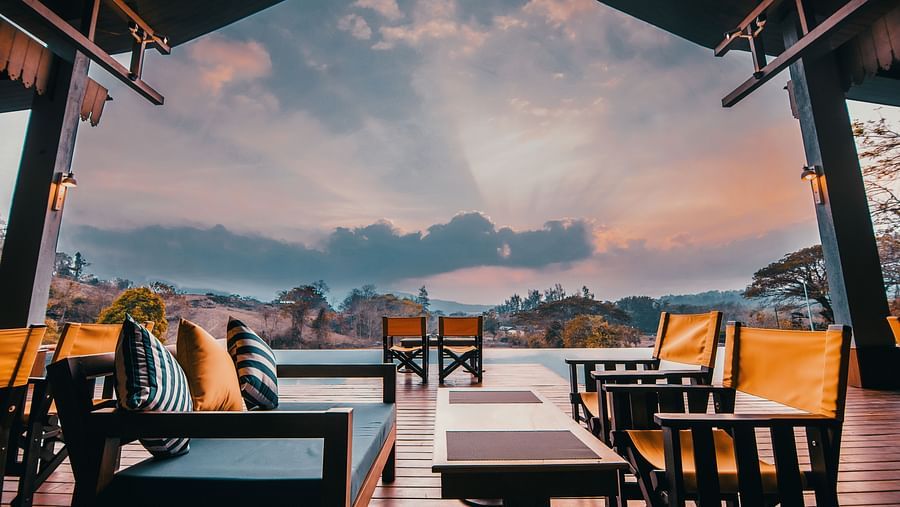 Multi-colured_chairs_overlooking_a_vibrant_sky.jpeg