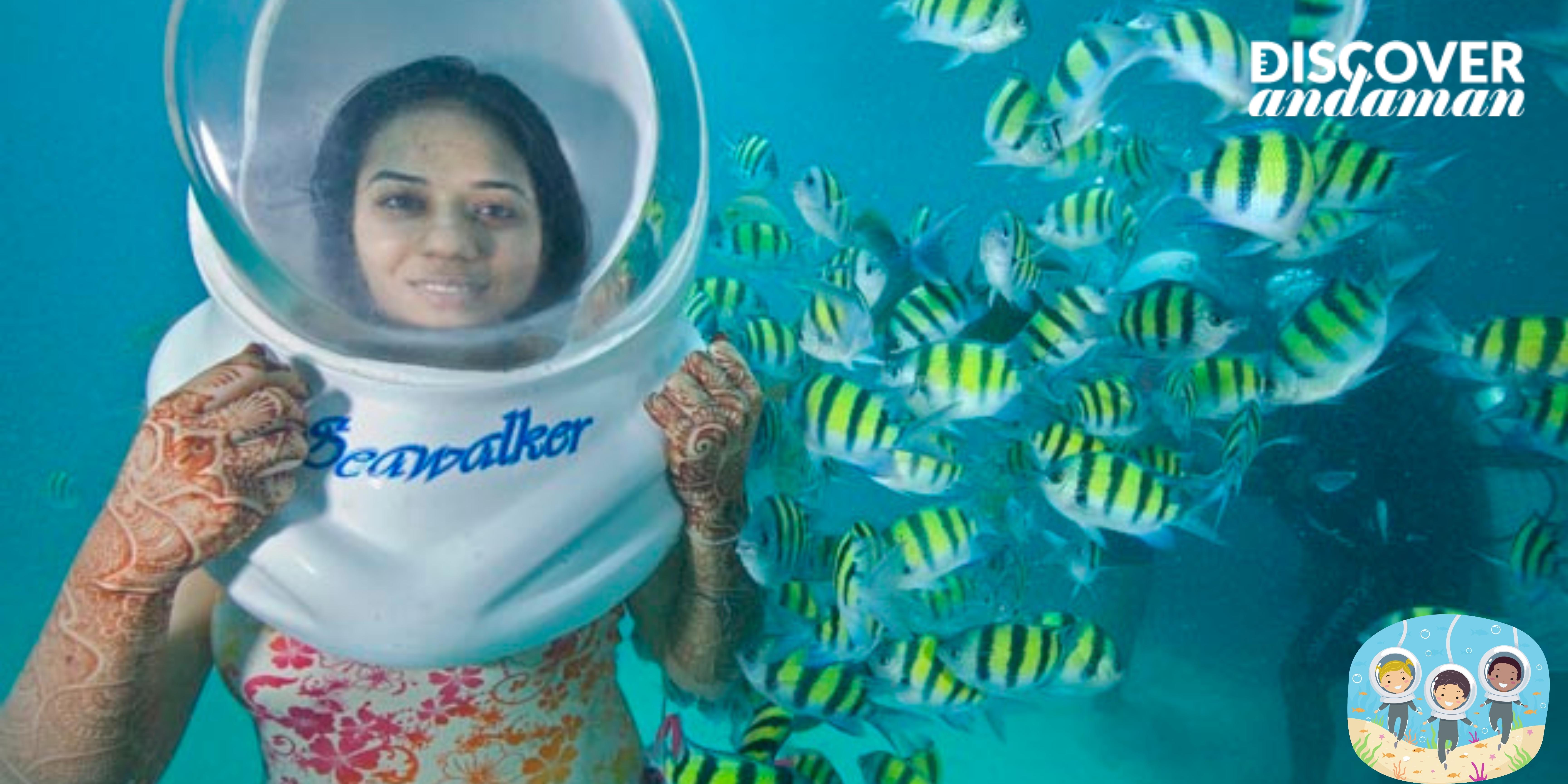 A girl seeing flock of fishes during sea walk in elephant beach.jpg